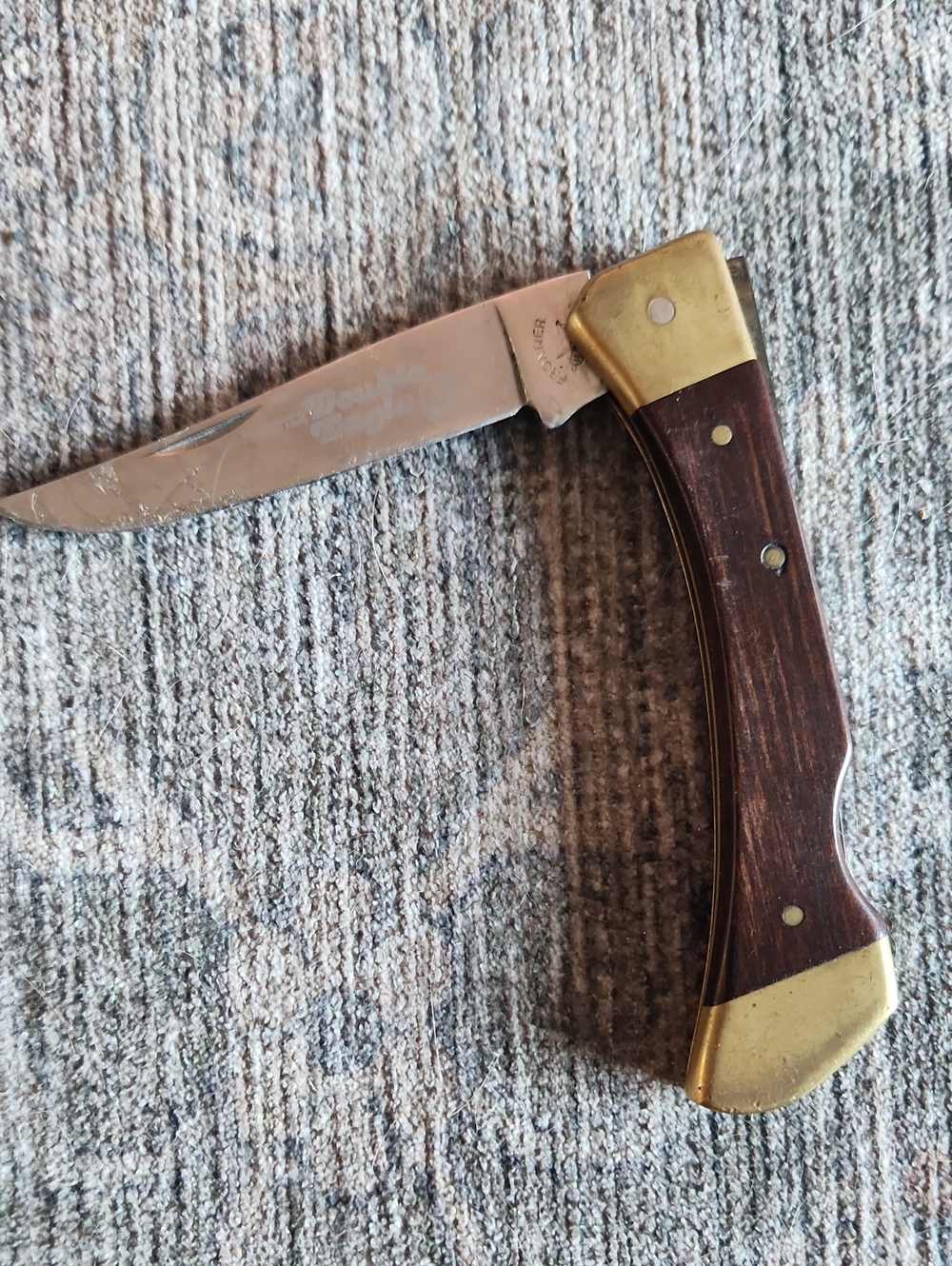Men's Folding Pocket Knife with Dark Wood Handle and Brass Bolsters